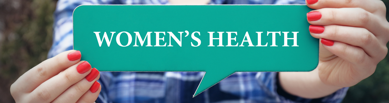 Hands holding paper with words women's health