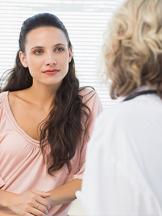 Woman talks to doctor during appointment